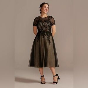 Embroidered tea length dress. Padded top with tulle underneath. NWT